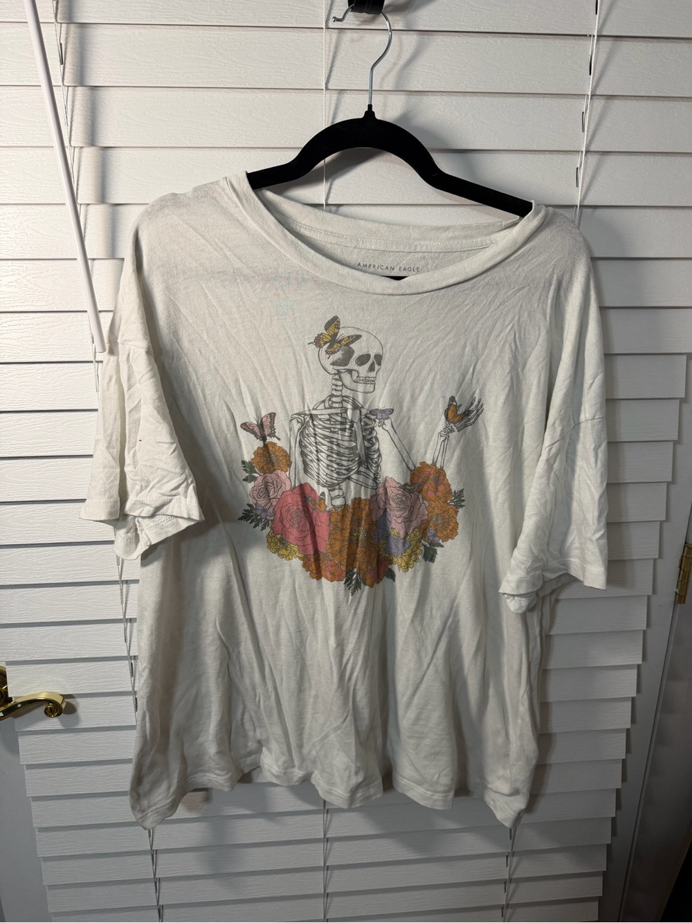 American Eagle Outfitters White Tee with Skull, Floral & Butterflies Graphic